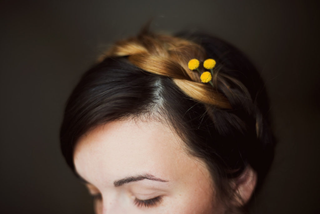 pretty girl with yellow flower in hair