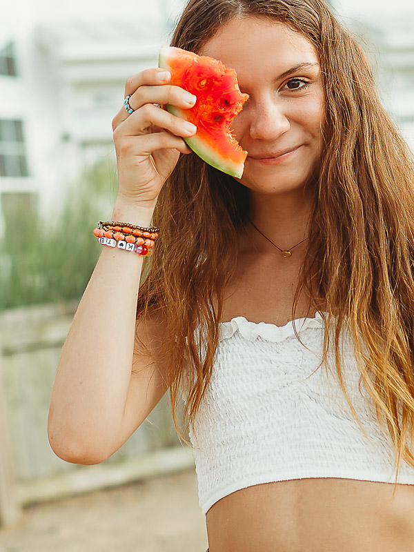 high school girl holding a watermelon