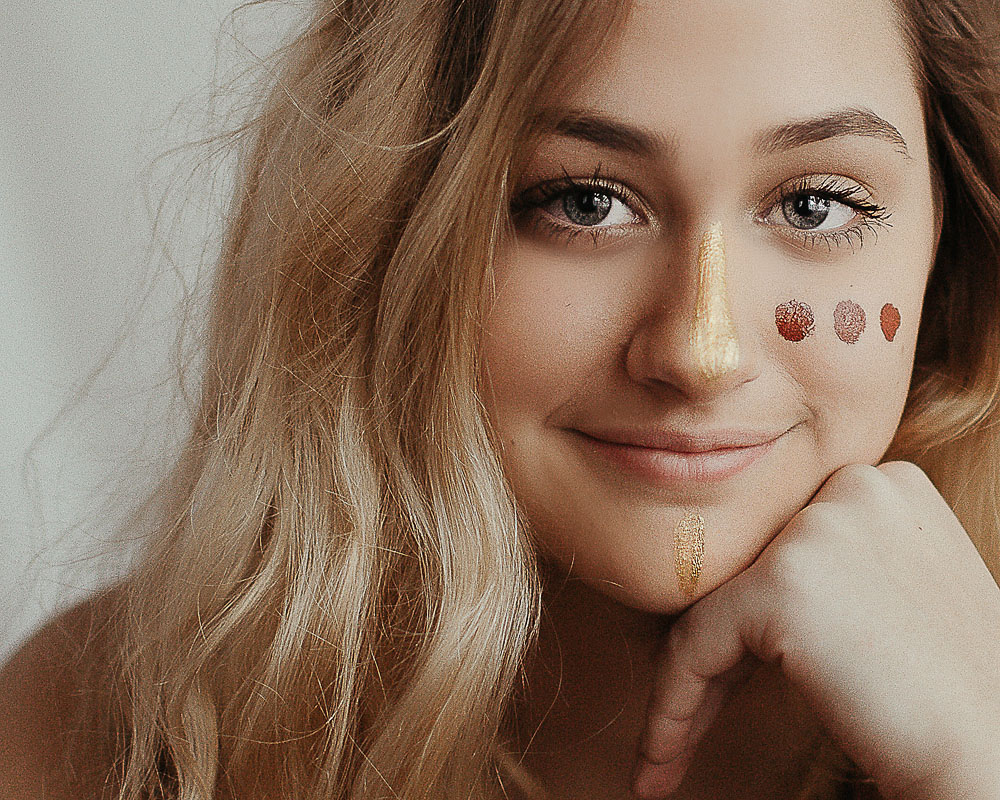 high school girl with face colorful face paint