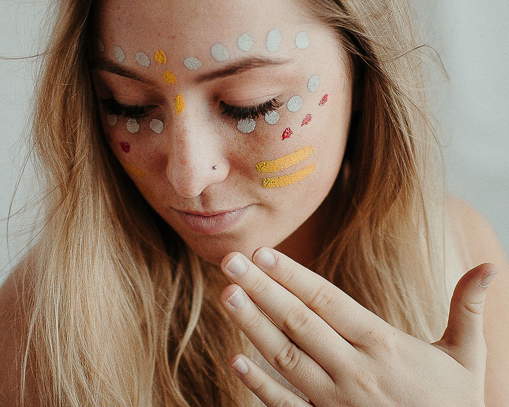 girl with colorful paint on her face