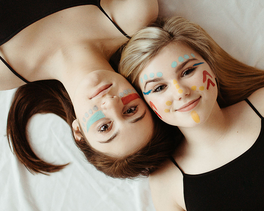 high school girl with face colorful face paint