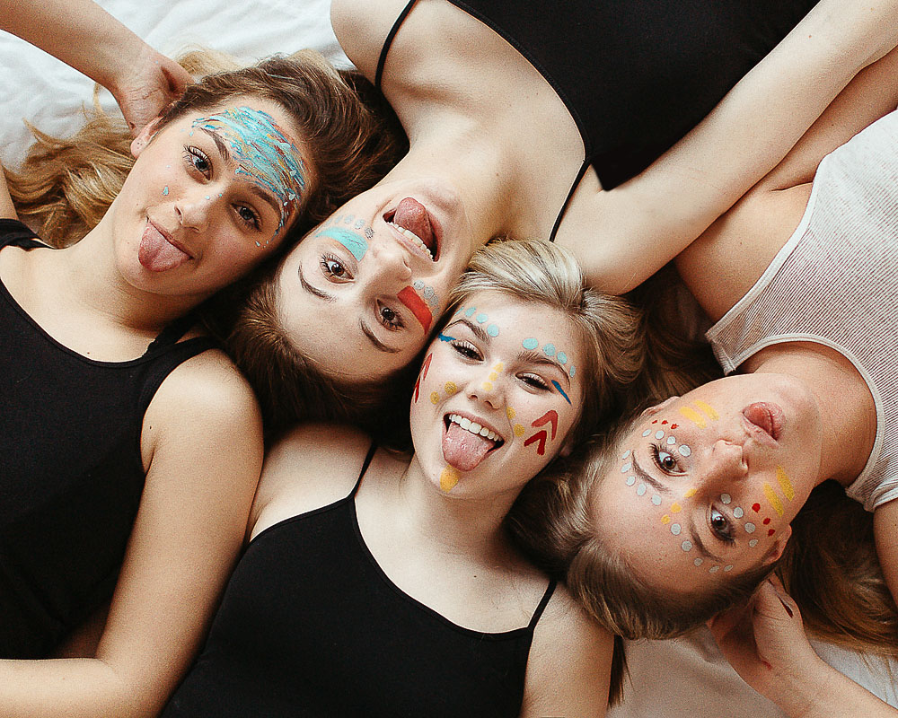 high school girl with face colorful face paint