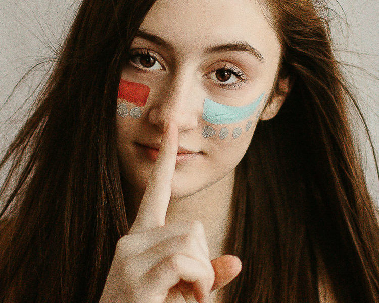 high school girl with face colorful face paint