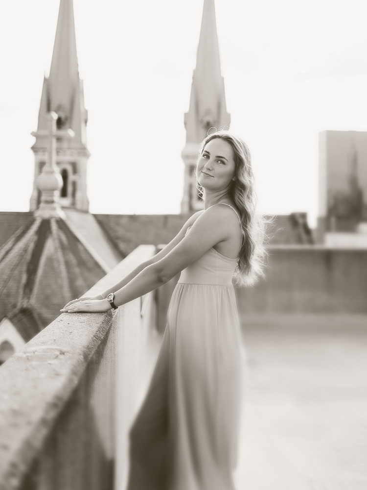 black and white image of pretty girl on rooftop