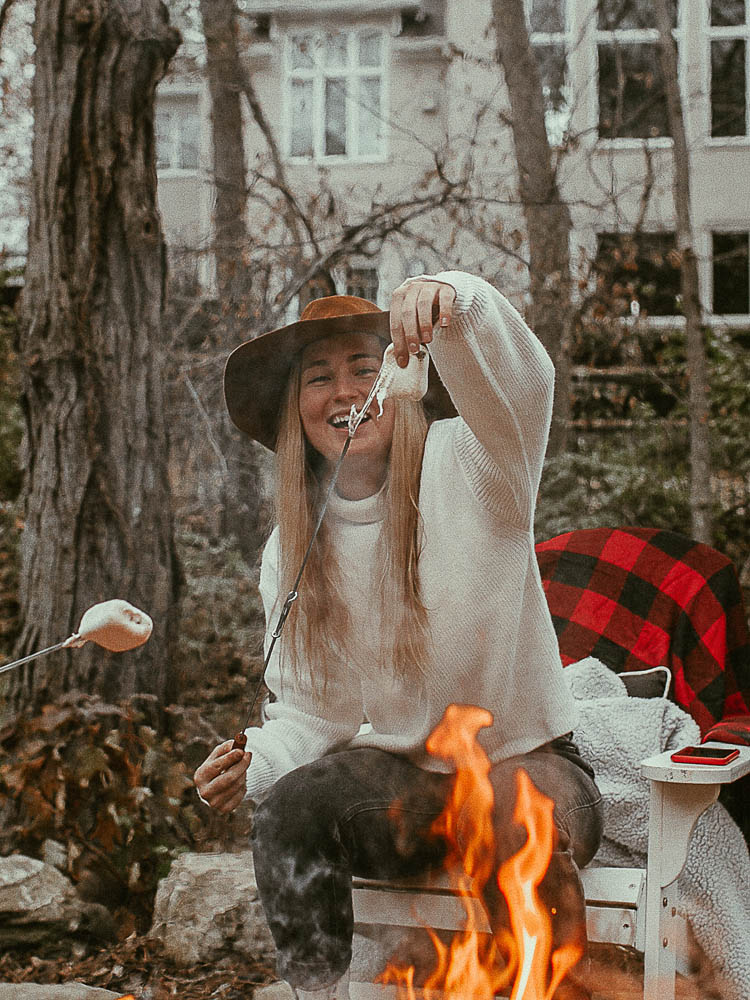 campfire with girl roasting s'mores