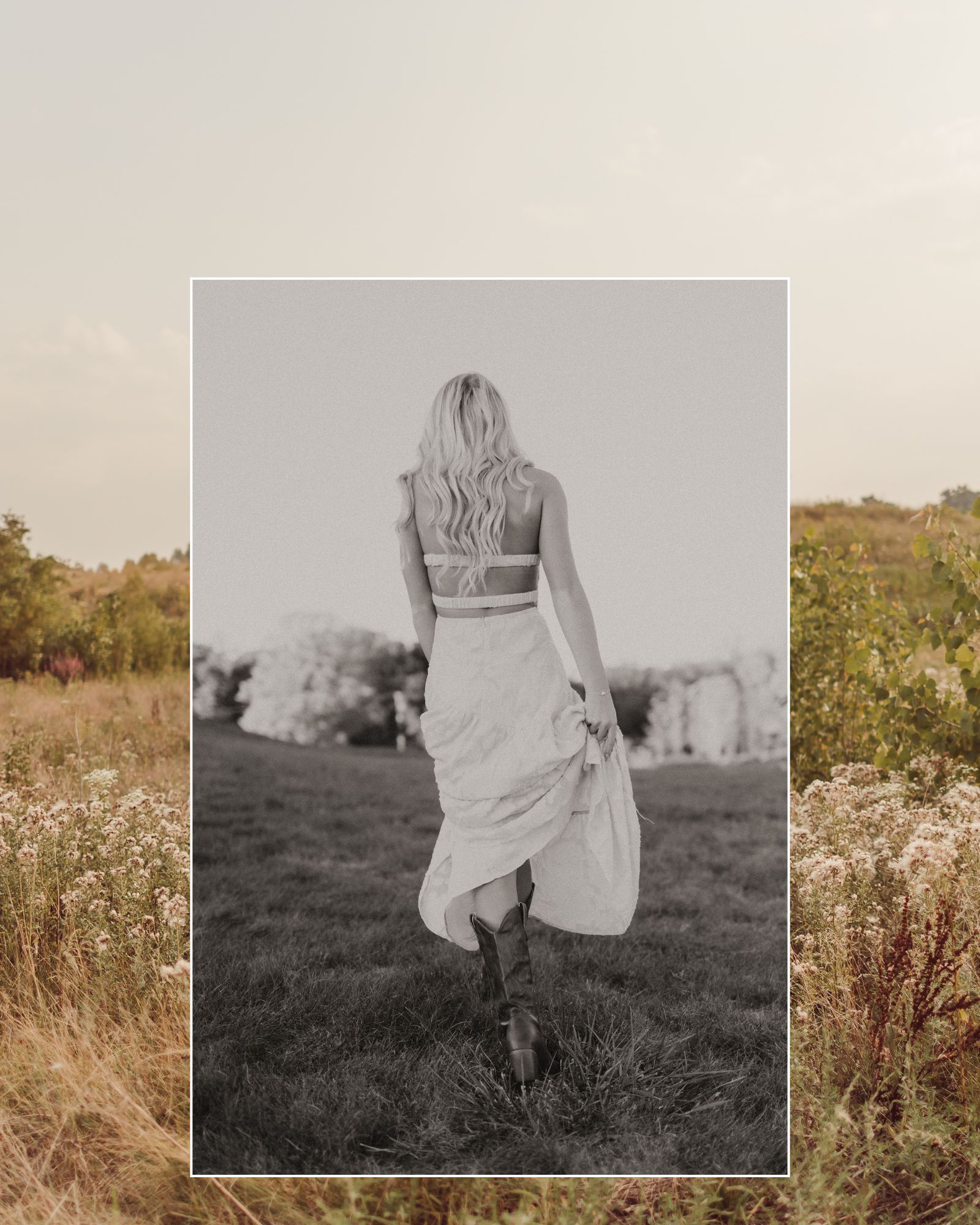 Blonde teenage girl walking thorugh field of flowers wearing a purple dress.